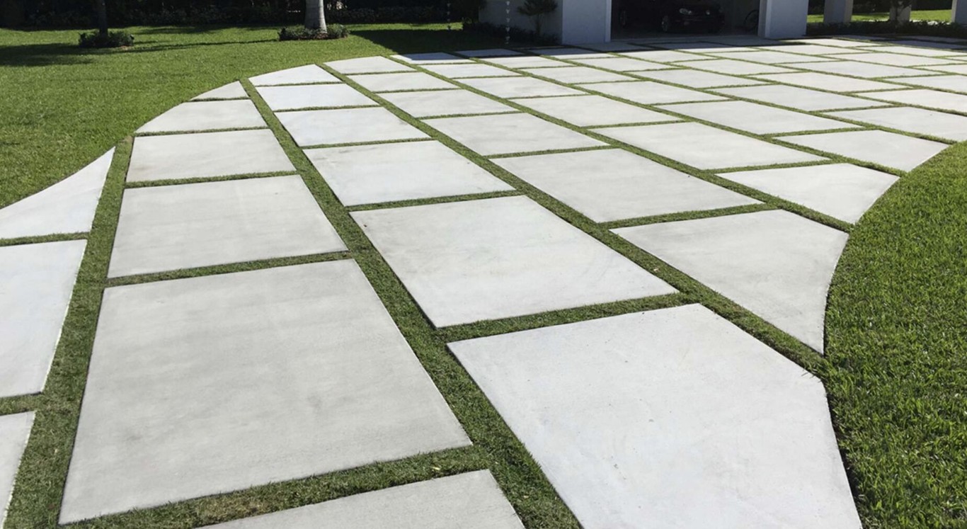 Modern concrete driveway with geometric pavers in Arlington, VA